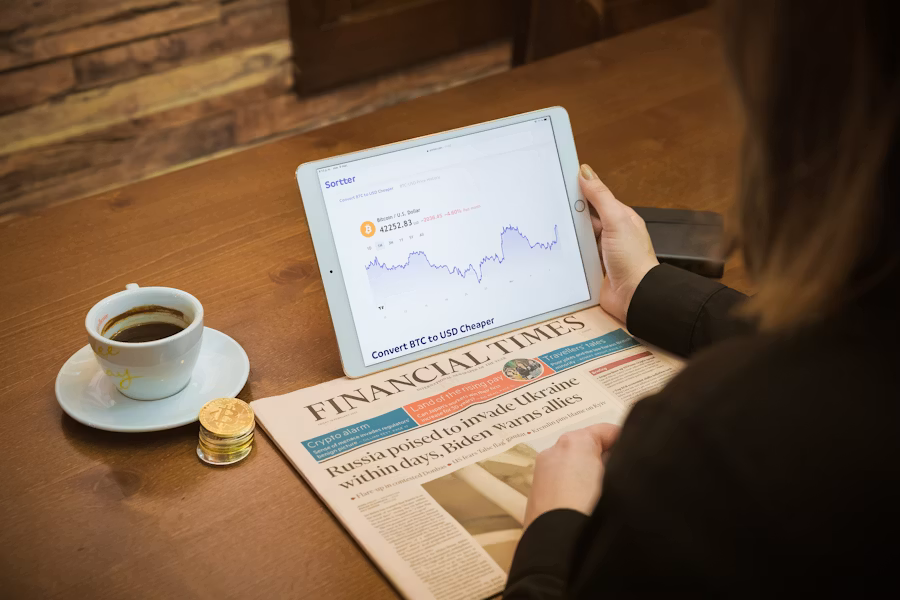 Analyst reviewing market coverage on a laptop